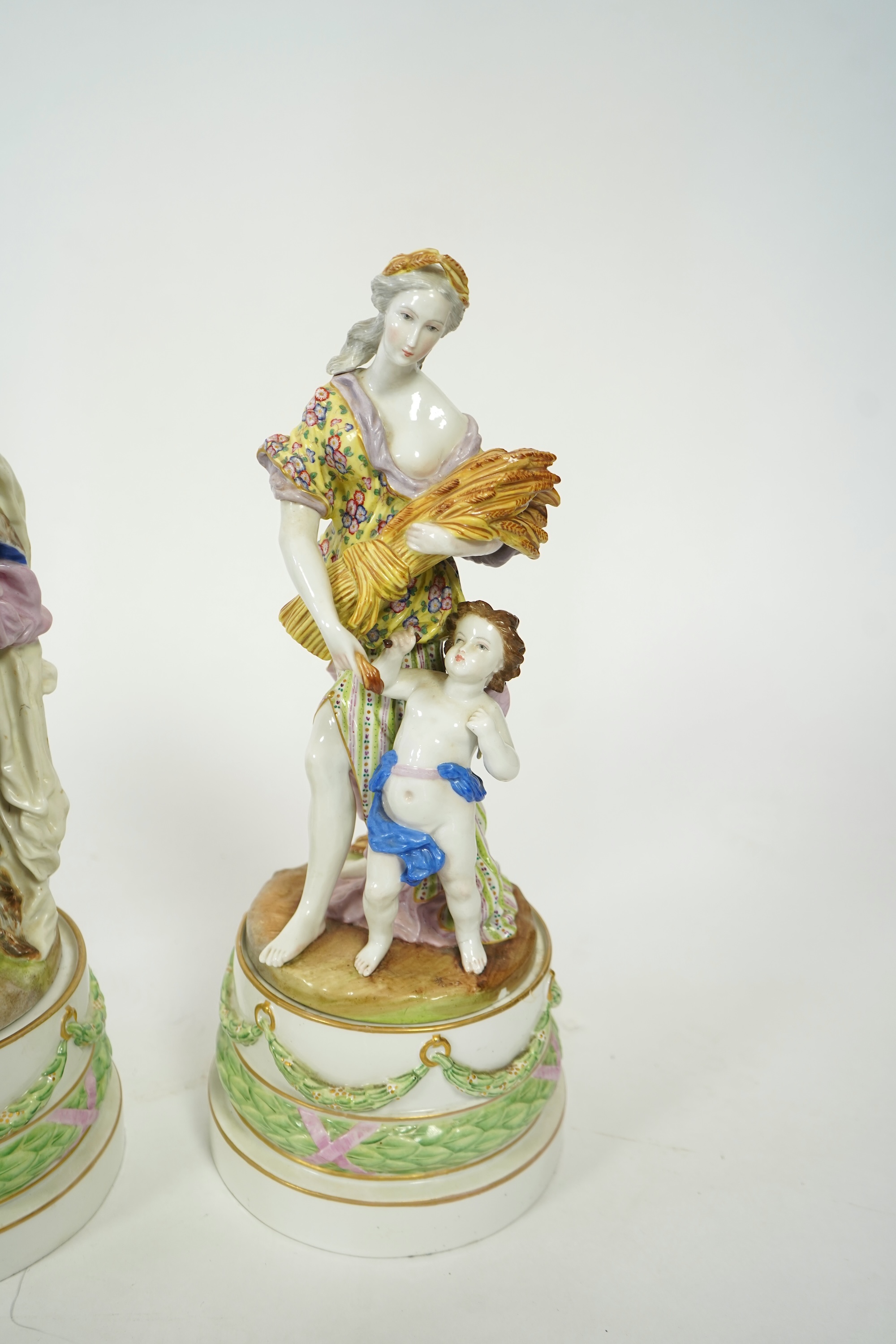 A set of four large Meissen style 'Four Seasons' groups and separate pedestals